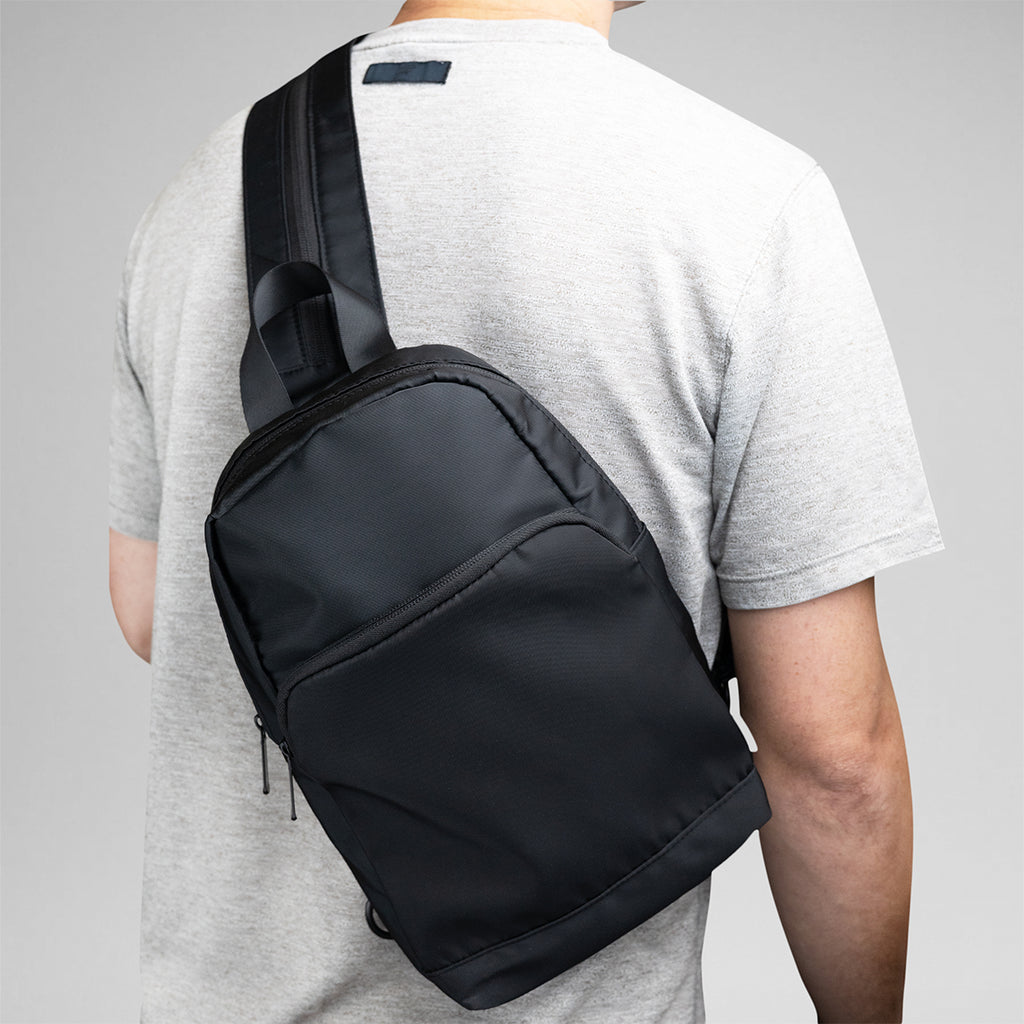 Caleb Convertible Backpack and Sling Bag in Recycled PET - Black - Sling_Inuse