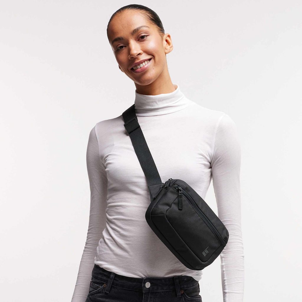 GOT BAG Sling Bag in Recycled Ocean Plastic, 2.4 L Embroidery - Black - Front On Model 2