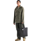 Herschel Classic Tote in Recycled Fabric Transfer - Black - Right Angle On Model 2