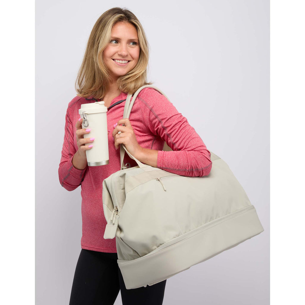 High Sierra Courier Duffel Bag with Drop Bottom Embroidery - Limestone Grey - On Model 2