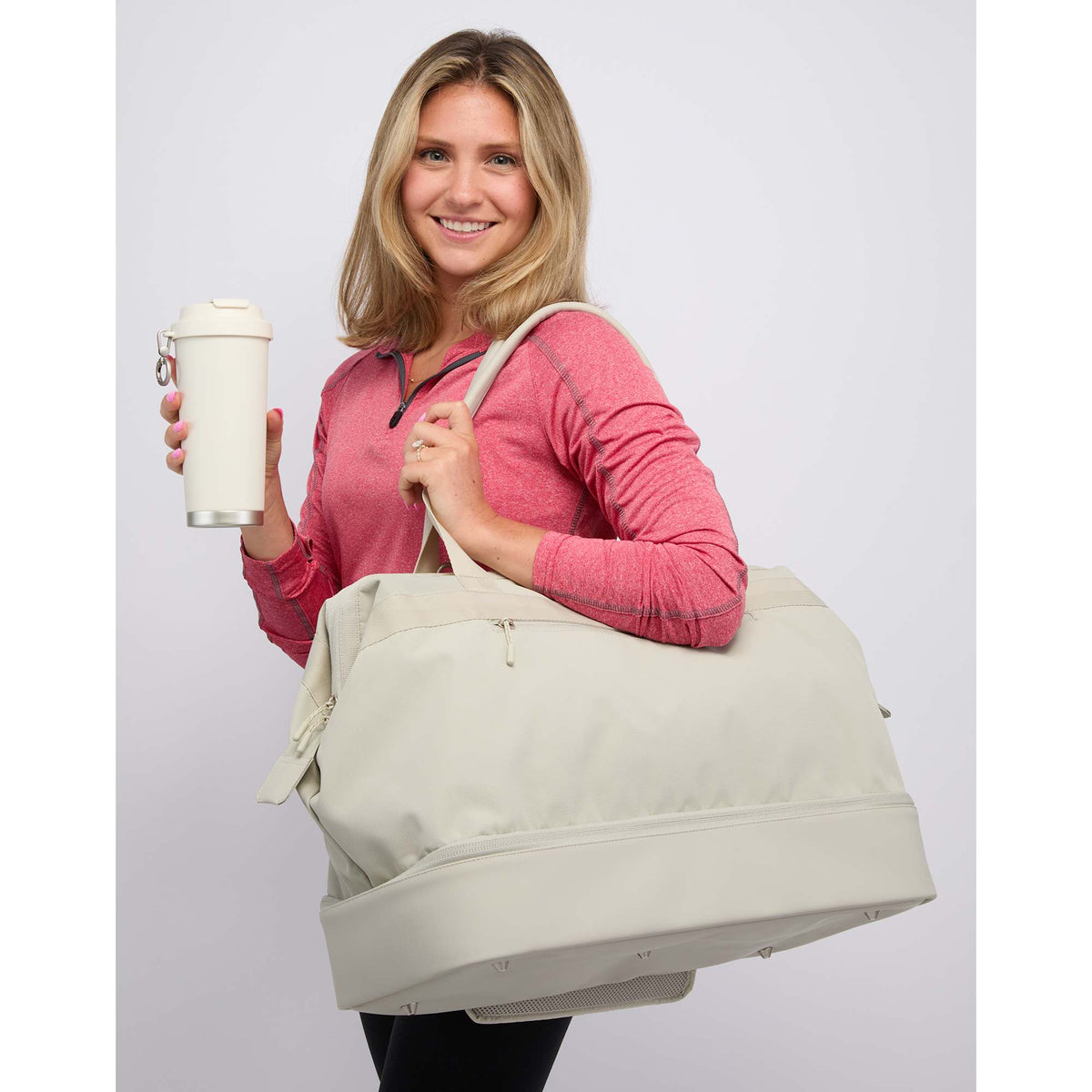 High Sierra Courier Duffel Bag with Drop Bottom Transfer - Limestone Grey - On Model