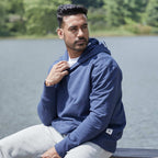 Roots73 Canmore Eco Pullover Hoodie, Unisex Embroidery - Indigo Blue - Left Angle On Model 3