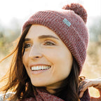 Roots73 Shelty Pom Beanie with Fleece Band Embroidery - Dark Red Heather - On Model