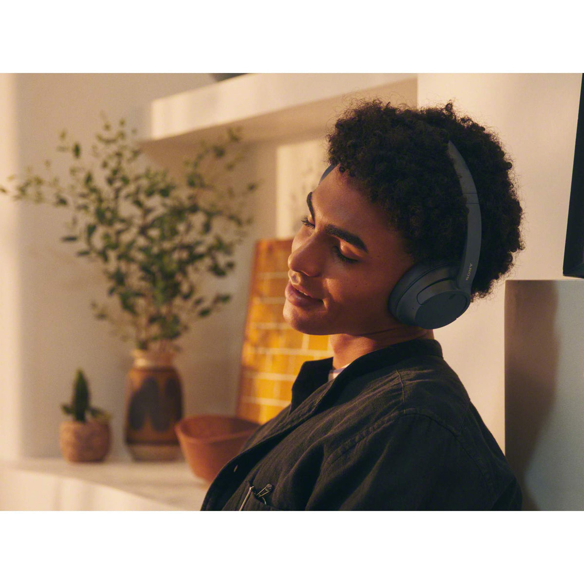 Sony WH-CH720N Noise Canceling Wireless Headphones - Black - Left Angle Lifestyle 2