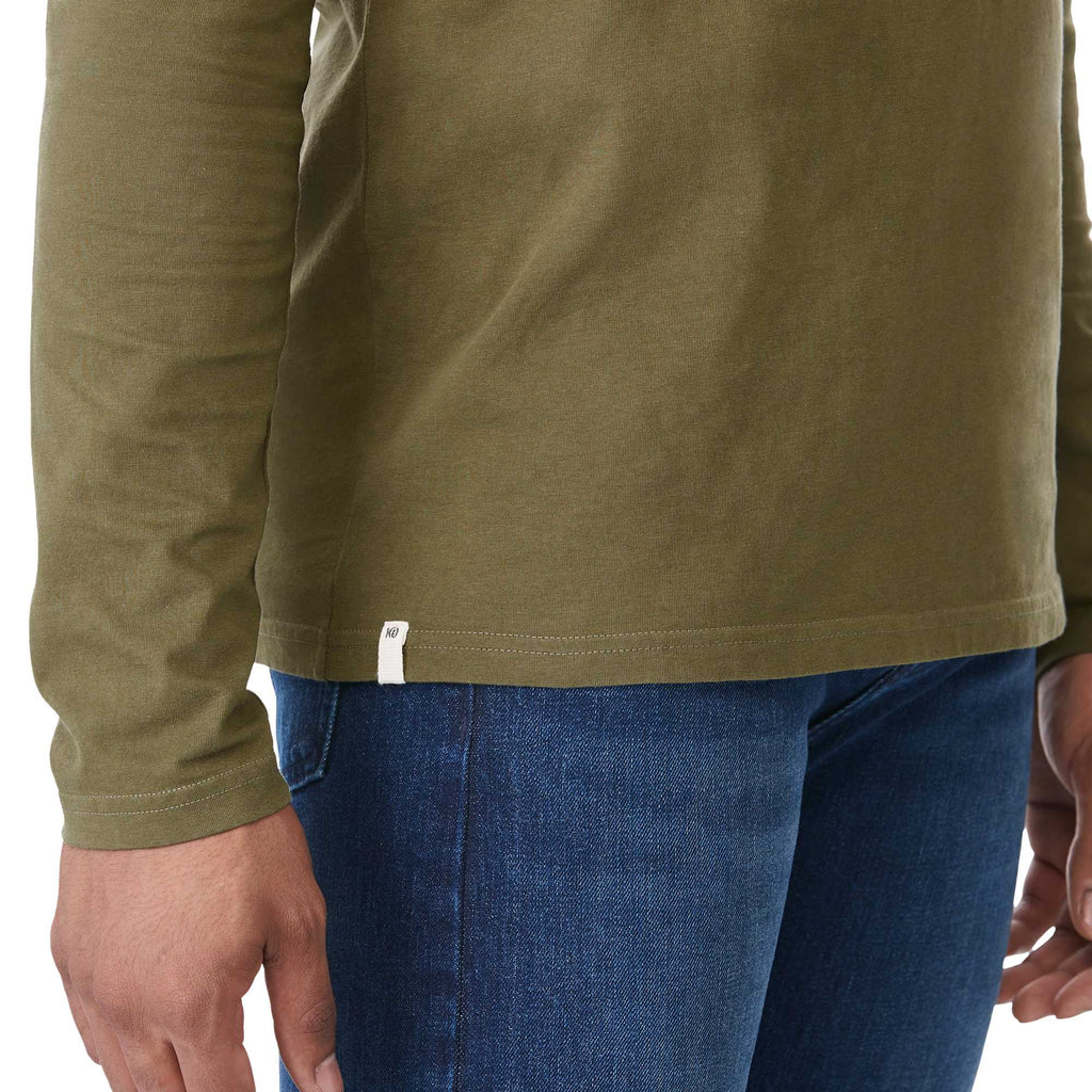 tentree Long Sleeve Tee in Fairtrade Organic Cotton for Men Transfer - ten Olive Night Green - Right Angle On Model 2