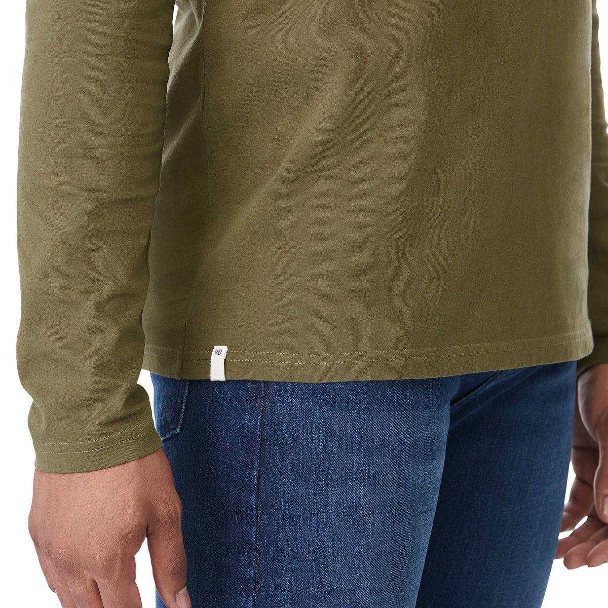 tentree Long Sleeve Tee in Fairtrade Organic Cotton for Men Transfer - ten Olive Night Green - Right Angle On Model 2