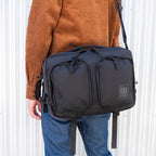 Topo Designs Global Briefcase with Backpack Straps Embroidery - Black - Front On Model