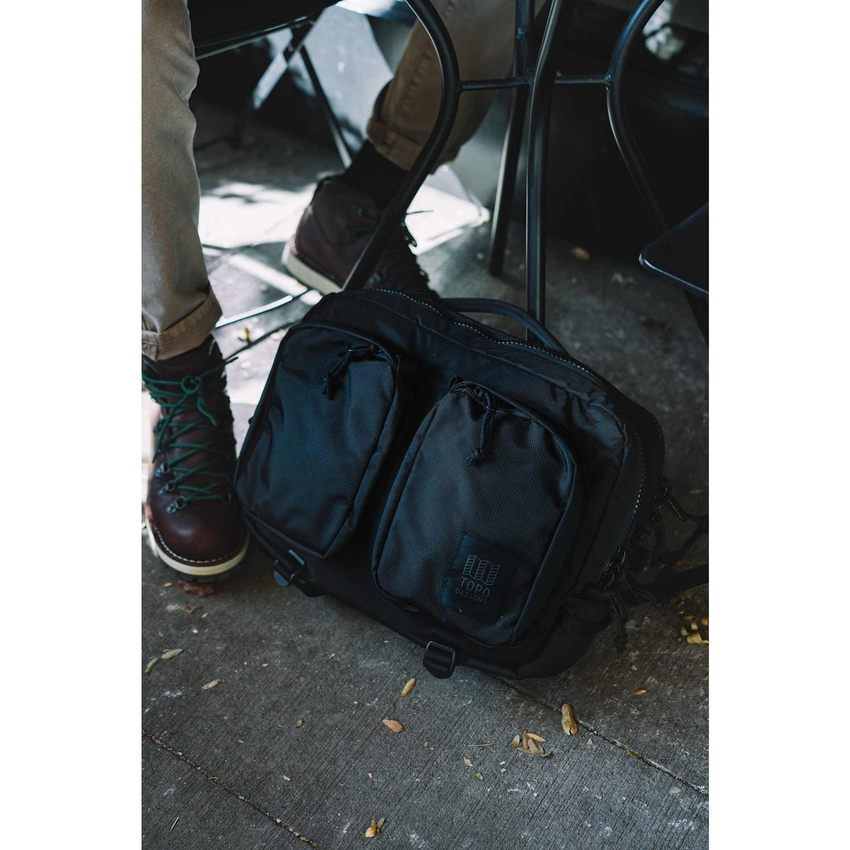 Topo Designs Global Briefcase with Backpack Straps Embroidery - Black - Left Angle Lifestyle